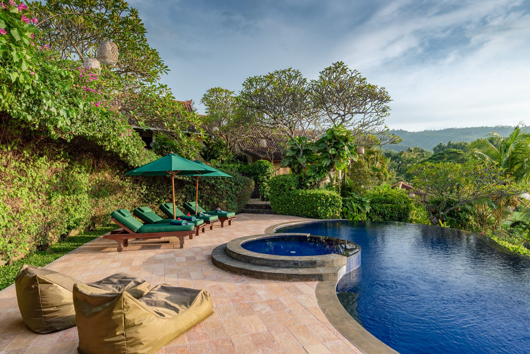 Alamanda Lovina Resort seen wide, showing pool, garden and accommodation buildings