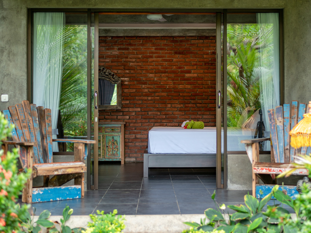 Poolside Jungle Room Duraka at Alamanda framed by tropical planting