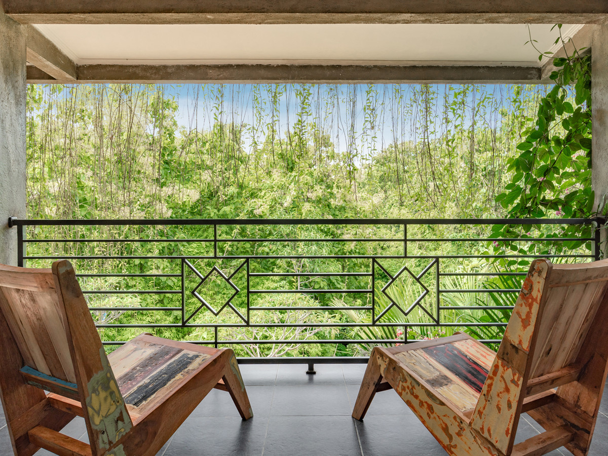 Jungle Room Hathi at Alamanda with its bed and garden-facing terrace